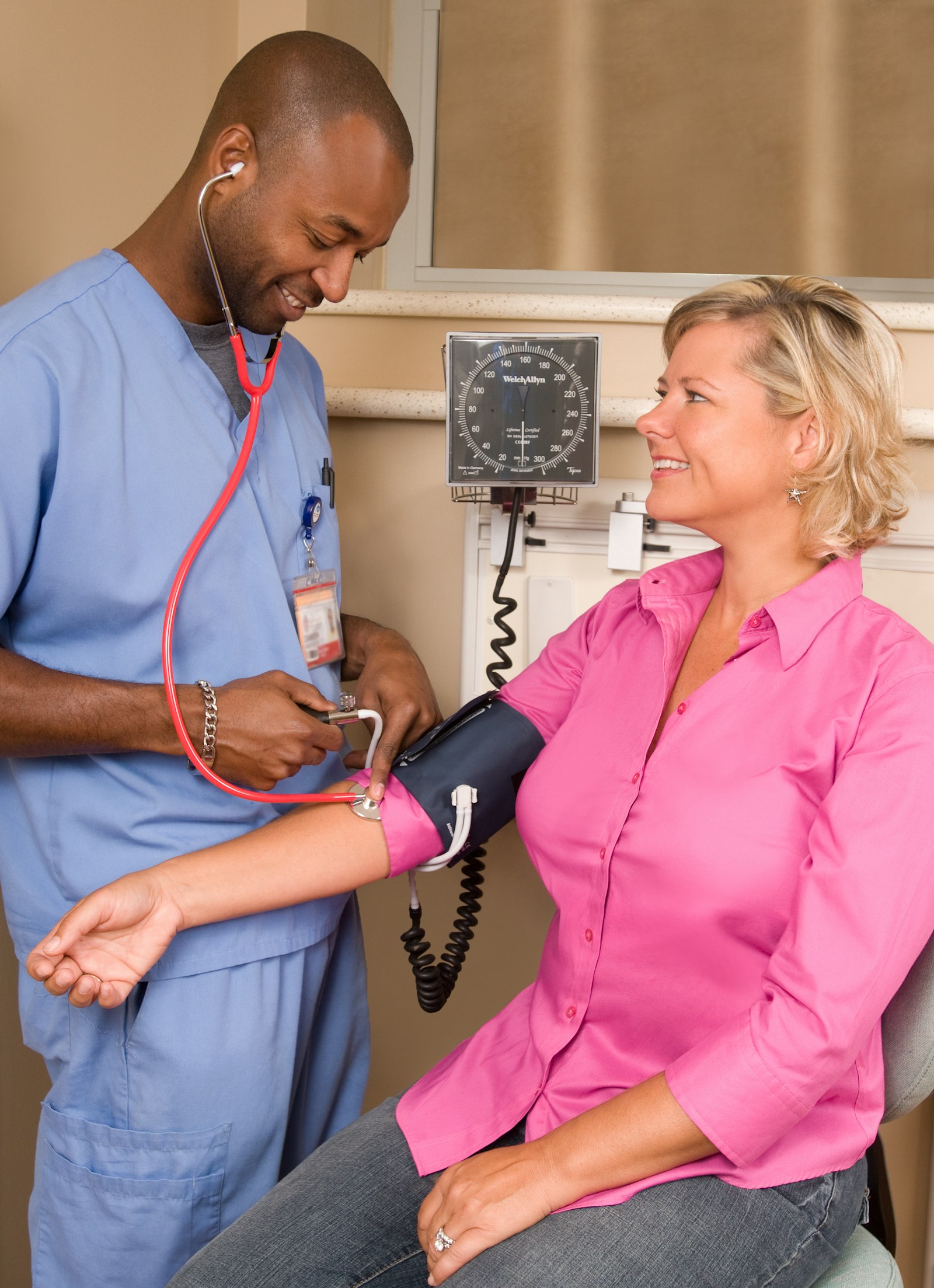 Nurse taking a patient's blood pressure